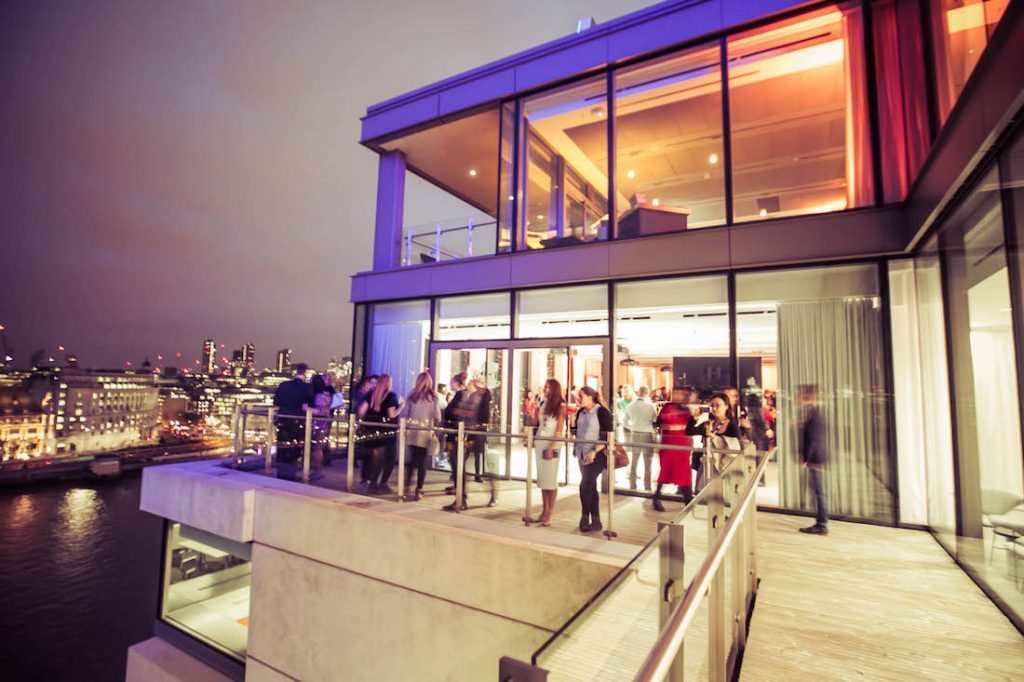 Sea Containers Events Guests On Terrace At Night With River Thames In Background