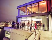 Sea Containers Events Guests On Terrace At Night With River Thames In Background